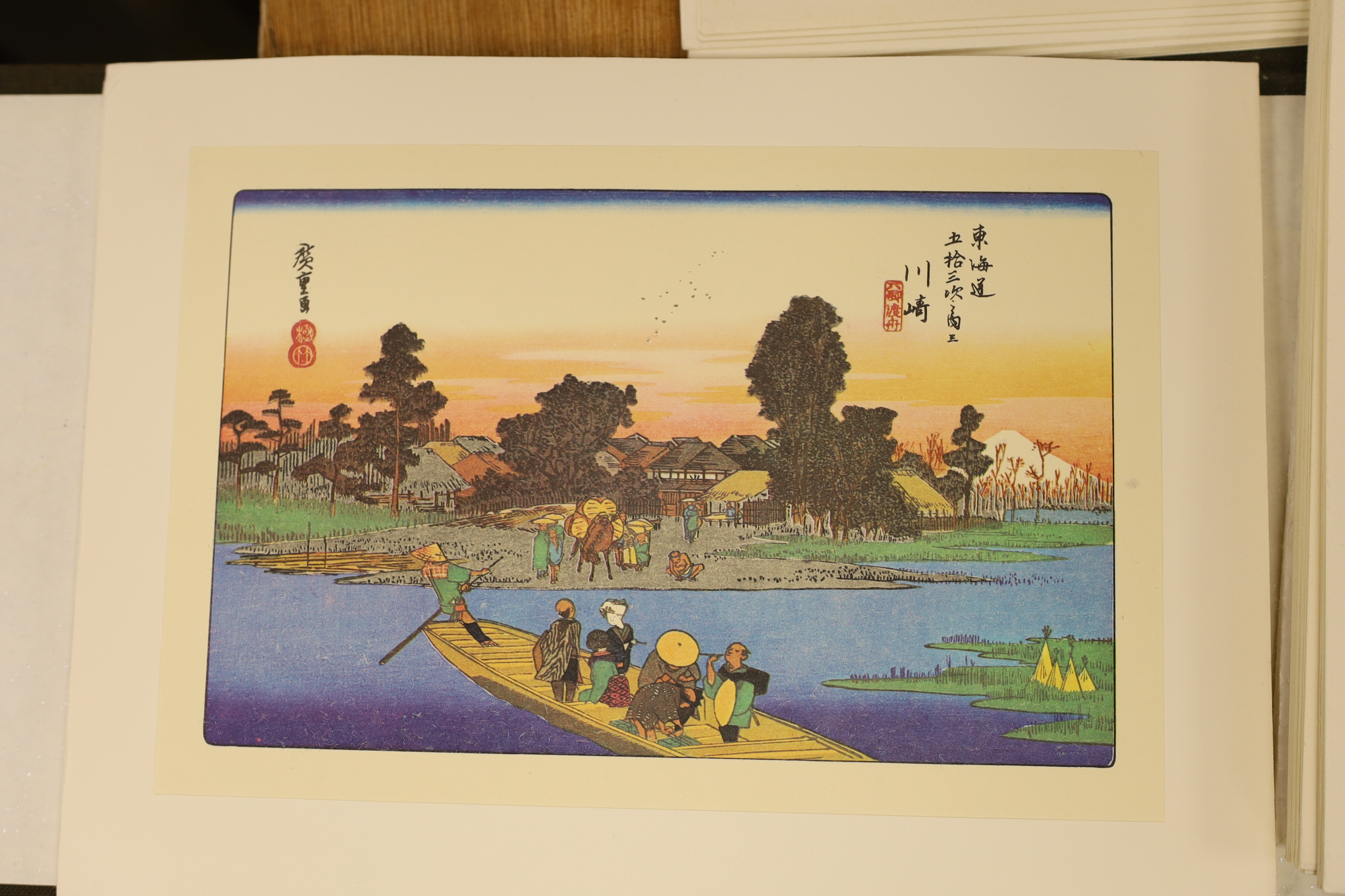 A group of reproduction Japanese woodblock prints, generally 16 x 24cm, in folder